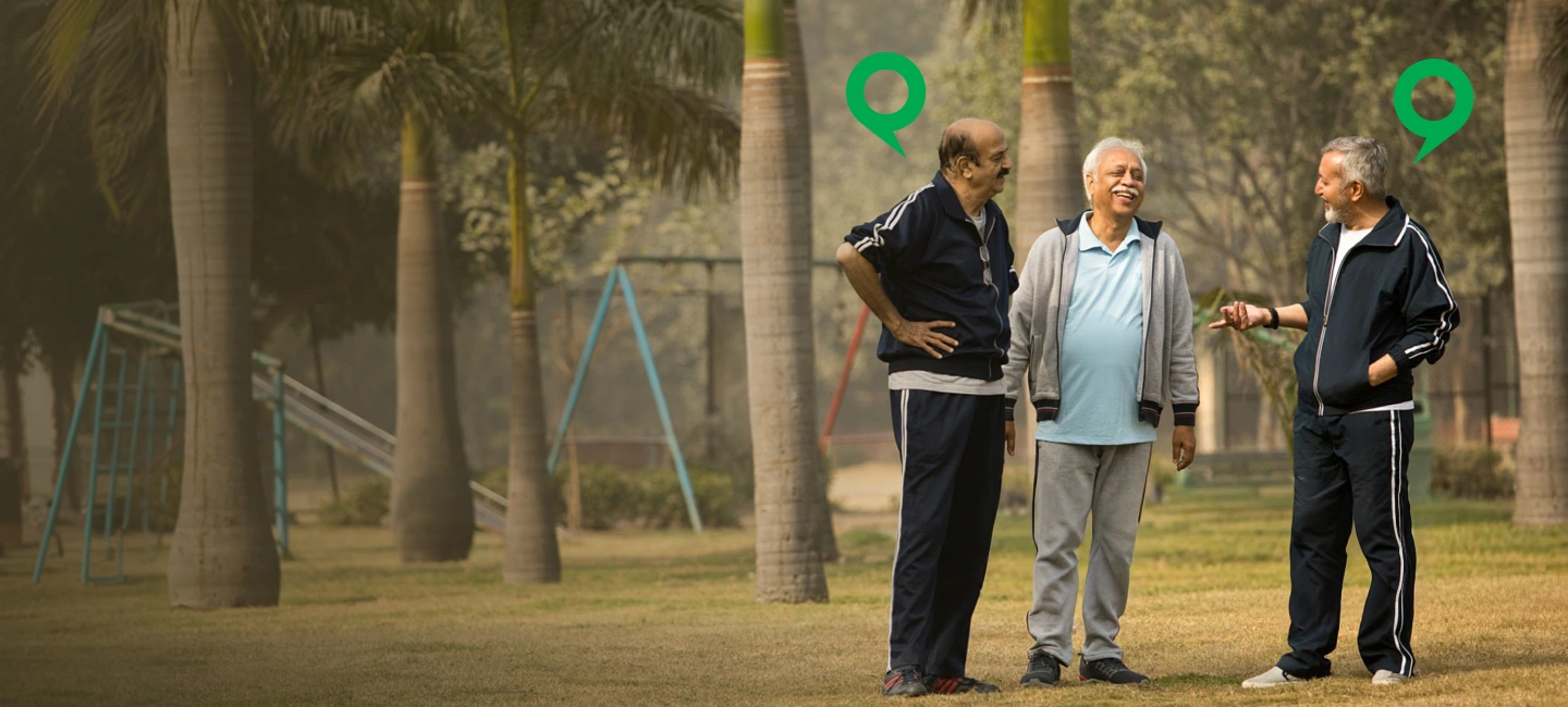 Three friends enjoying a conversation outdoors