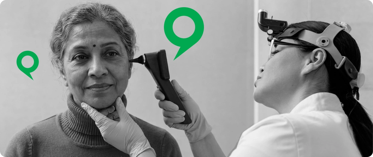 Audiologist providing a hearing examination at Sounds Good