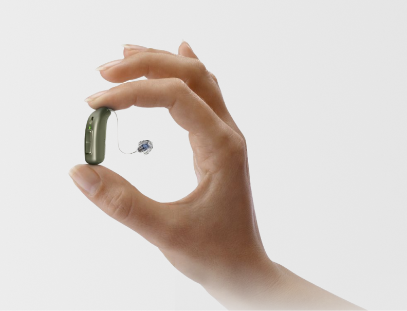 Hearing aid held in hand