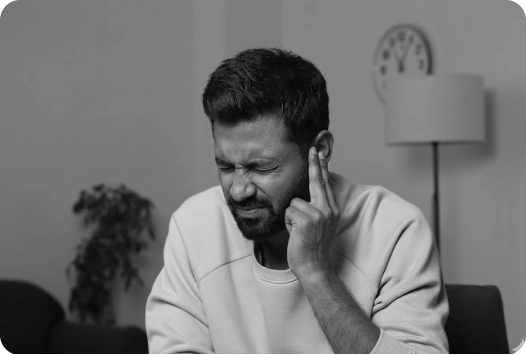 Person experiencing ear discomfort